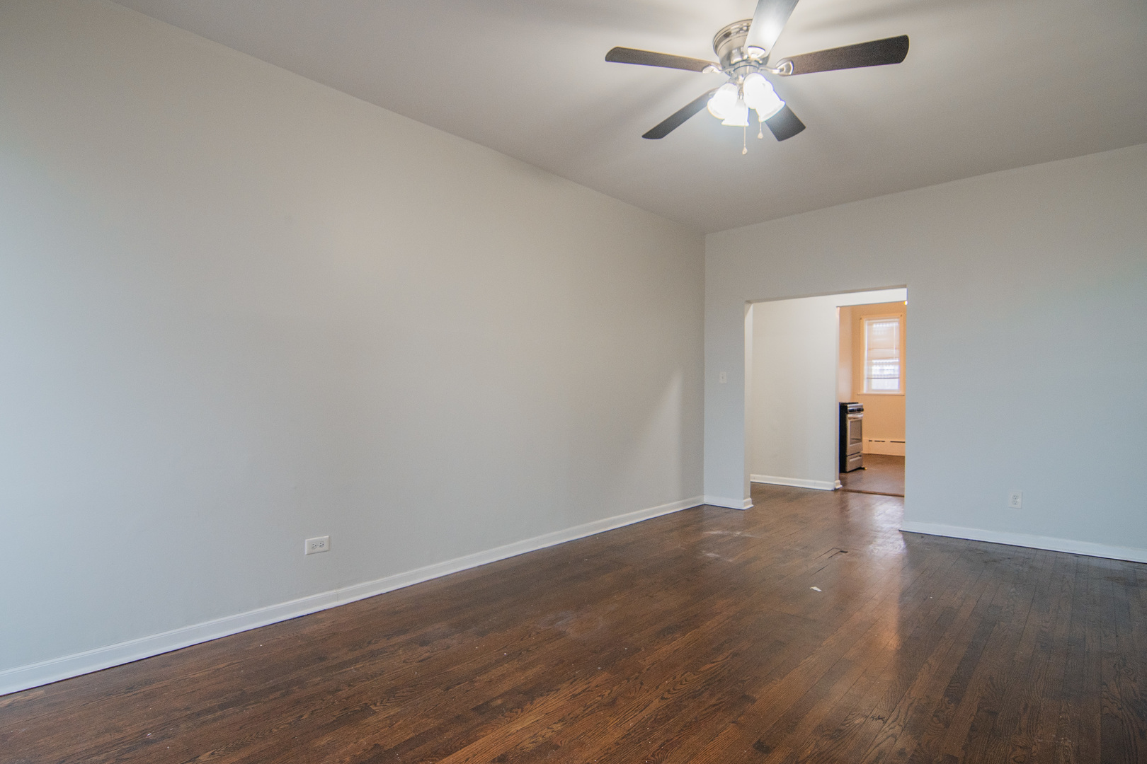 310 South Springfield Avenue, Unit 2S Chicago, IL 60624 - Photo 5 of 15 a view of empty room with wooden floor