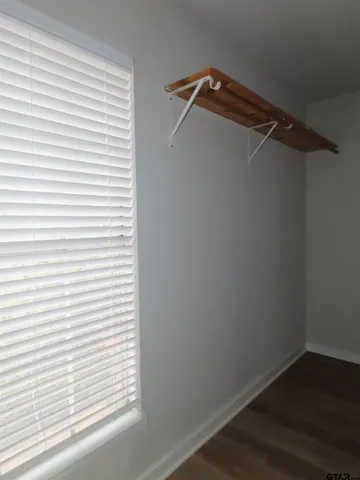 a view of a small space with racks on the wall