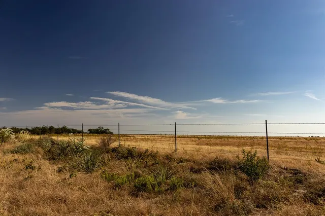a view of an ocean with a mountain view