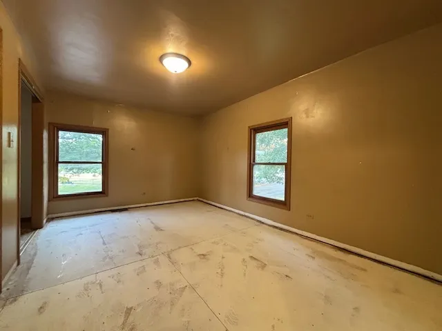 an empty room with windows