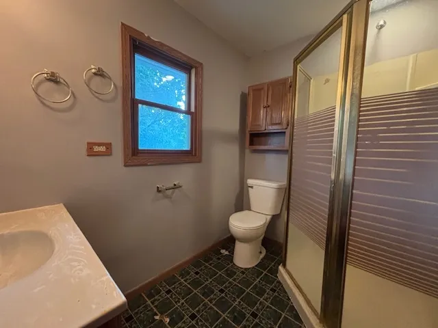 a bathroom with a toilet and a sink