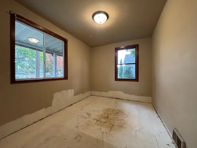 an empty room with windows