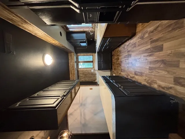 a kitchen with a sink and a stove