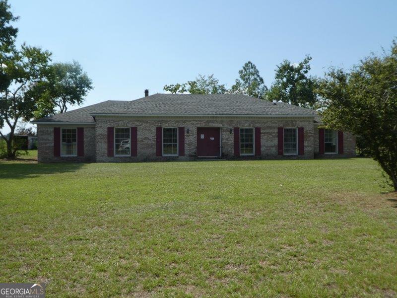 98 Ed Ray Road Denton, GA 31532 - Photo 1 of 1 a front view of house with yard and green space