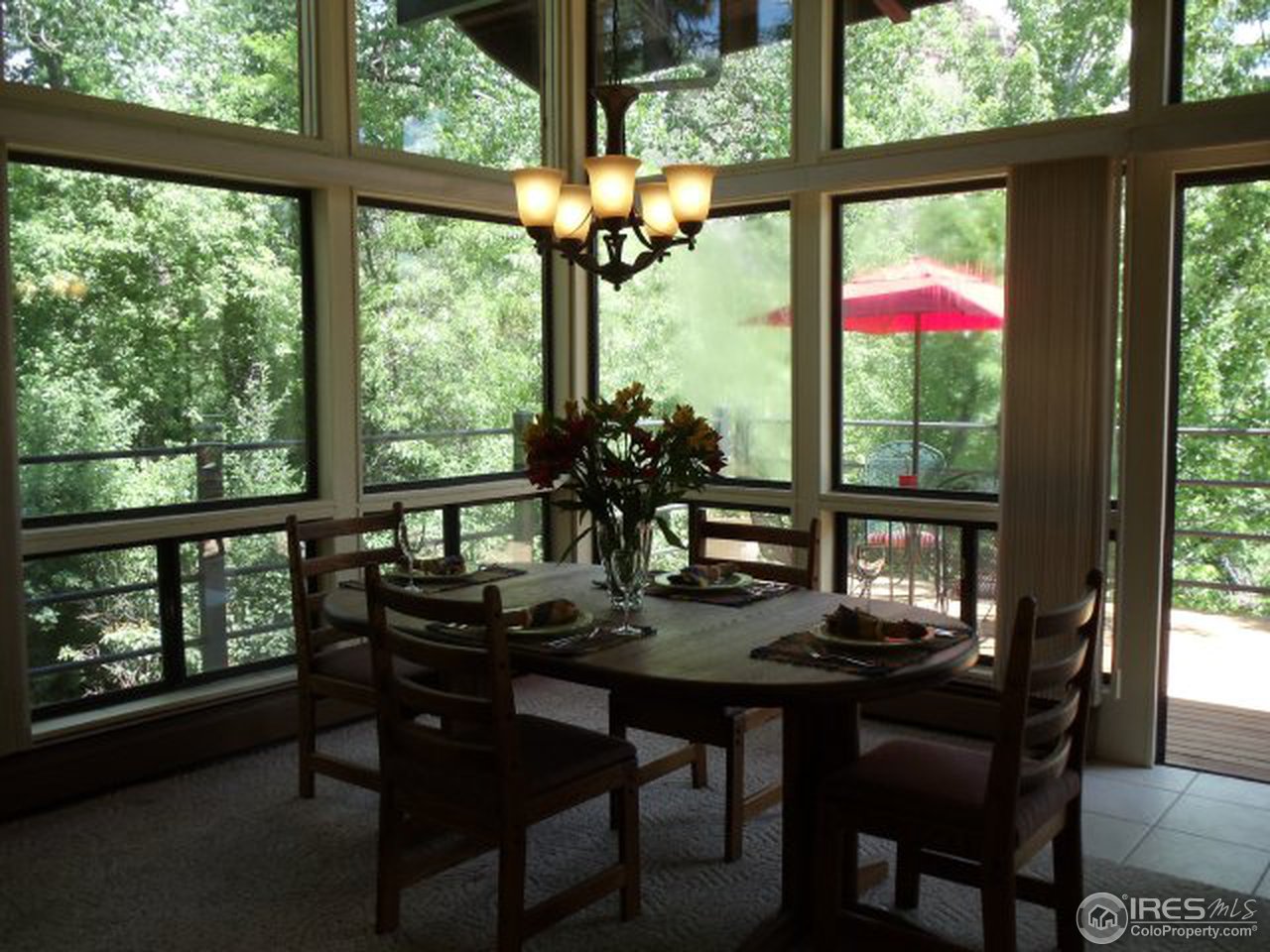 850 Apple Valley Road Lyons, CO 80540 - Photo 3 of 25 a view of a dining room with furniture window and outside view