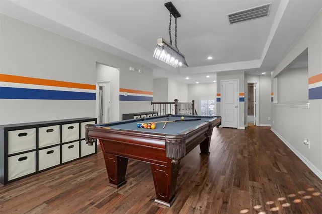 a room with furniture and a wooden floor