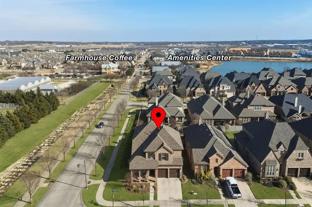 an aerial view of a houses with a outdoor space