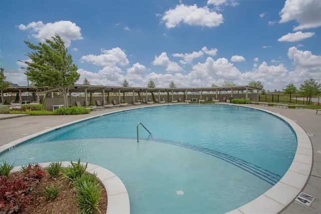 a view of a swimming pool with outdoor space