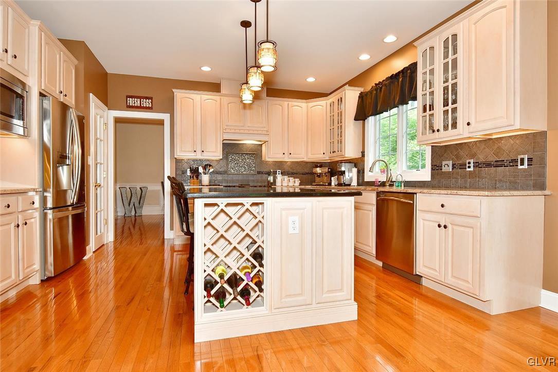 820 Texas Road Easton, PA 18042 - Photo 12 of 41 a kitchen with stainless steel appliances kitchen island granite countertop a stove a sink and a microwave