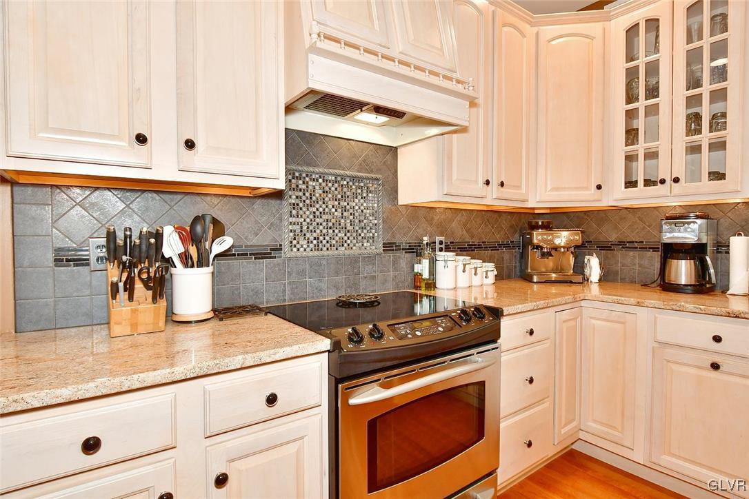 820 Texas Road Easton, PA 18042 - Photo 14 of 41 a kitchen with granite countertop white cabinets and white appliances