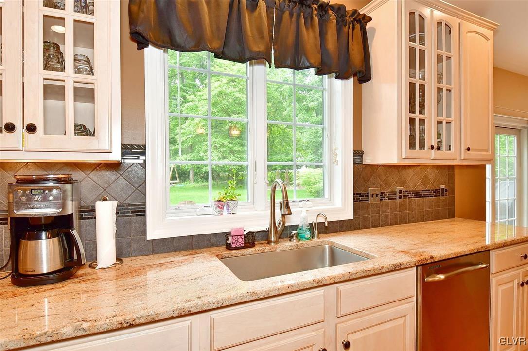 820 Texas Road Easton, PA 18042 - Photo 15 of 41 a kitchen with granite countertop a sink and a window