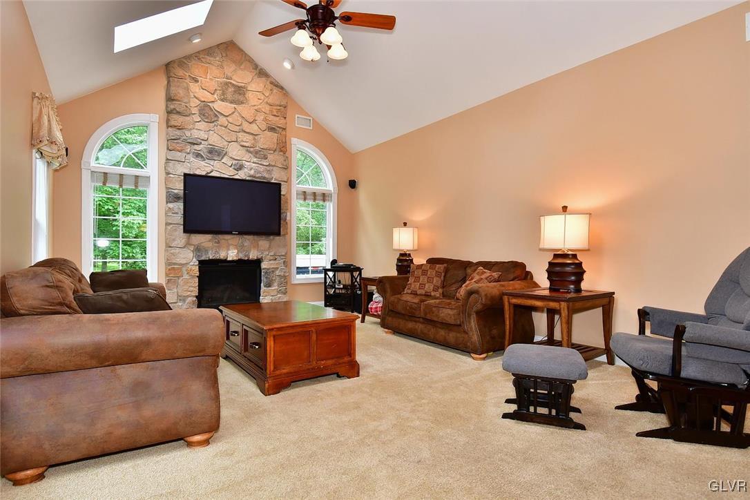 820 Texas Road Easton, PA 18042 - Photo 19 of 41 a living room with furniture a fireplace and a flat screen tv