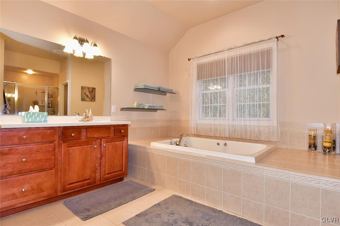 820 Texas Road Easton, PA 18042 - Photo 27 of 41 a spacious bathroom with a sink a large mirror and a bathtub