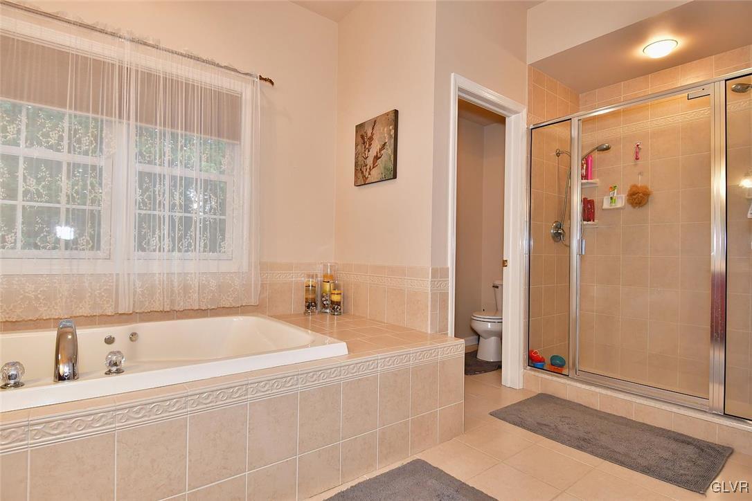 820 Texas Road Easton, PA 18042 - Photo 28 of 41 a spacious bathroom with a bathtub and a shower