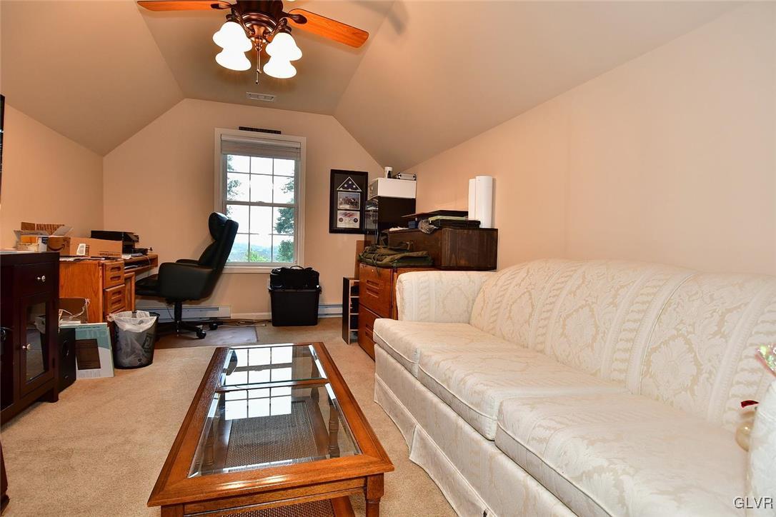 820 Texas Road Easton, PA 18042 - Photo 29 of 41 a living room with furniture chandelier and a fireplace