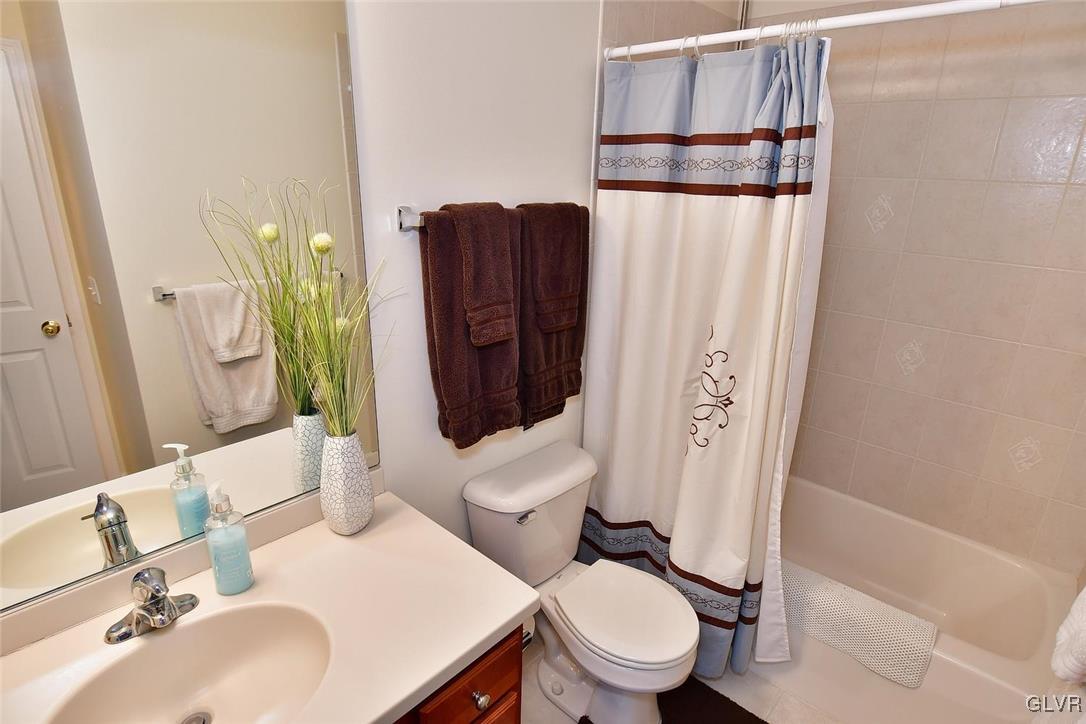 820 Texas Road Easton, PA 18042 - Photo 34 of 41 a white toilet sitting next to a bathroom sink