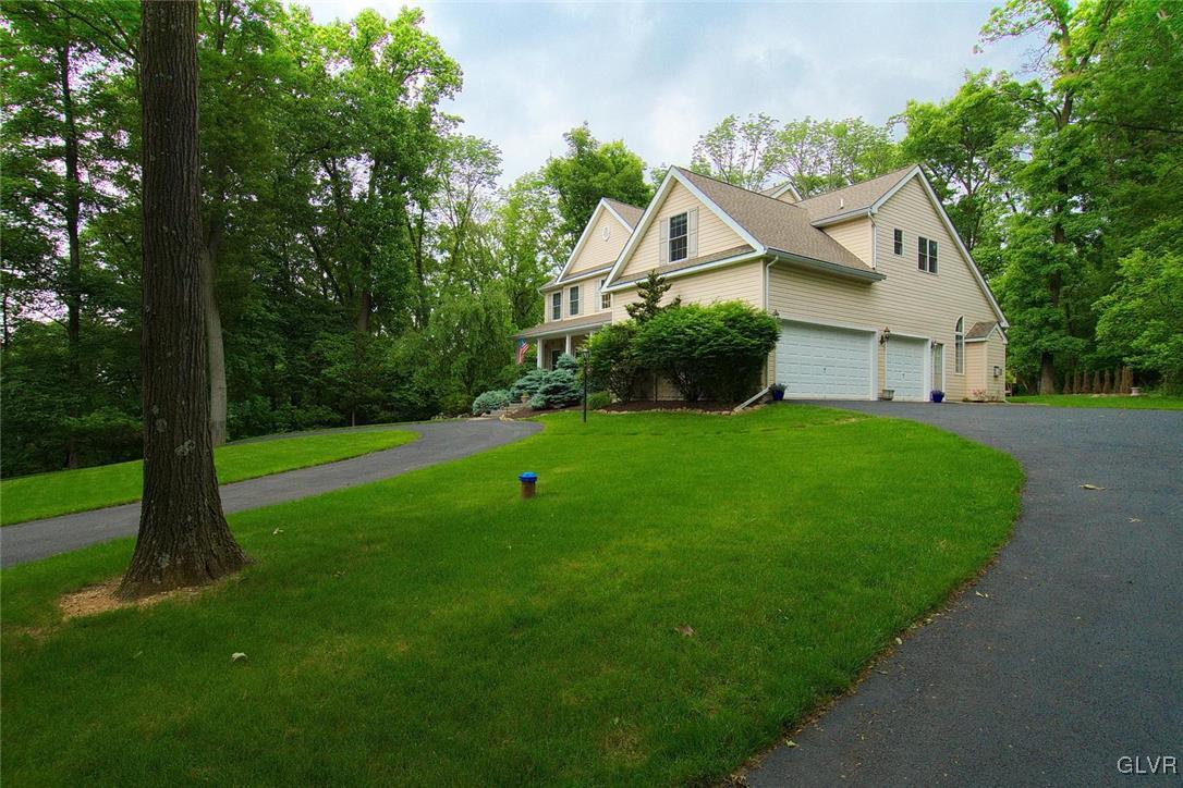 820 Texas Road Easton, PA 18042 - Photo 35 of 41 a view of a house with a big yard potted plants and large tree