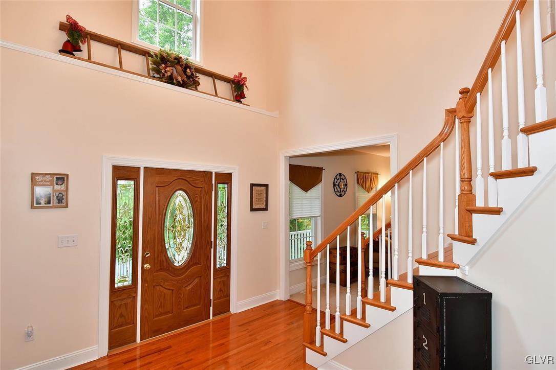 820 Texas Road Easton, PA 18042 - Photo 6 of 41 a view of hallway with stairs and wooden floor