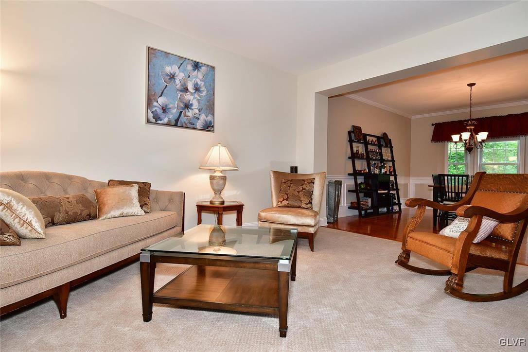 820 Texas Road Easton, PA 18042 - Photo 9 of 41 a living room with furniture a lamp and a potted plant