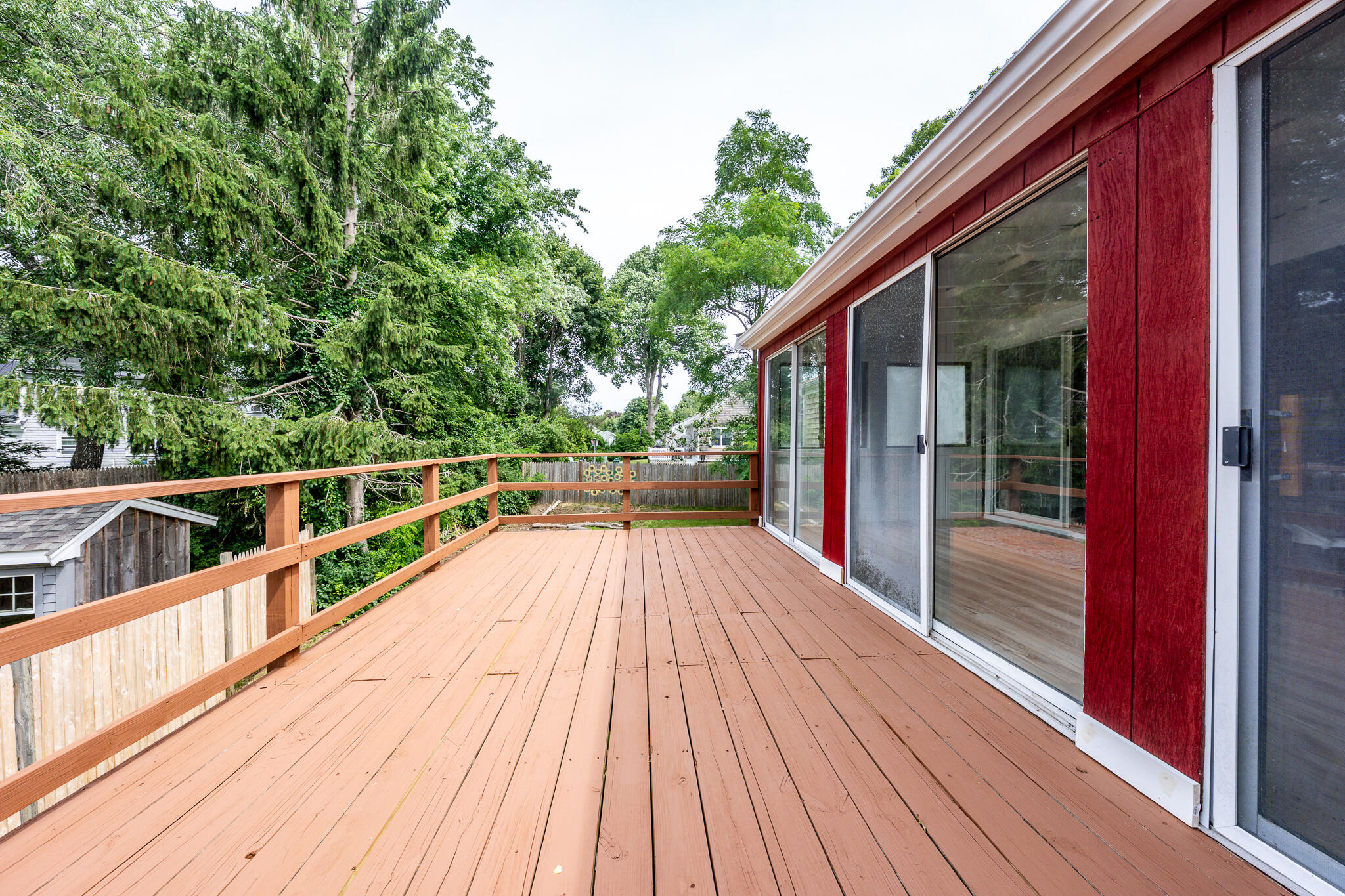 65 Elliott Road Centerville, MA 02632 - Photo 25 of 36 a view of a balcony with wooden floor and fence