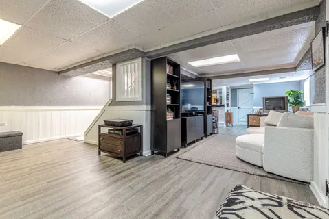 a workspace with furniture wooden floor and windows