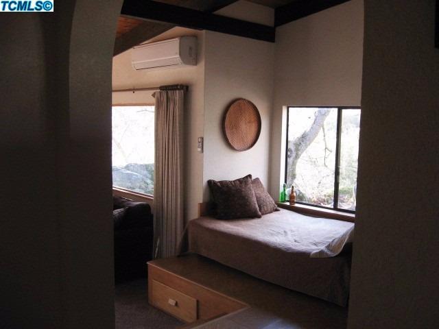 43065 Sierra Drive Three Rivers, CA 93271 - Photo 9 of 13 a bedroom with a bed and a window