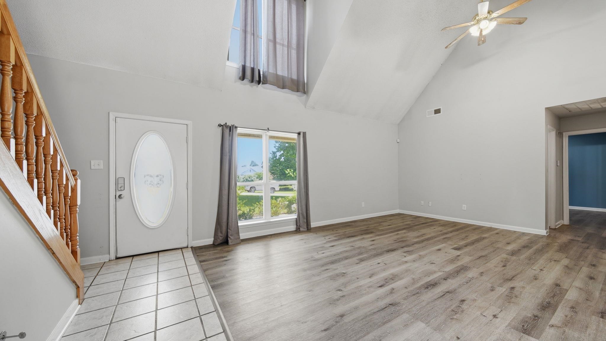 217 Rae Drive Munford, TN 38058 - Photo 4 of 40 Spacious great room featuring high vaulted ceilings, light wood-finish flooring, and a ceiling fan