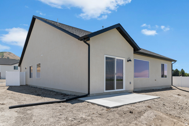 2362 1400 West, Unit 14 Perry, UT 84302 - Photo 5 of 22 Contemporary exterior with stucco siding and black trim accents