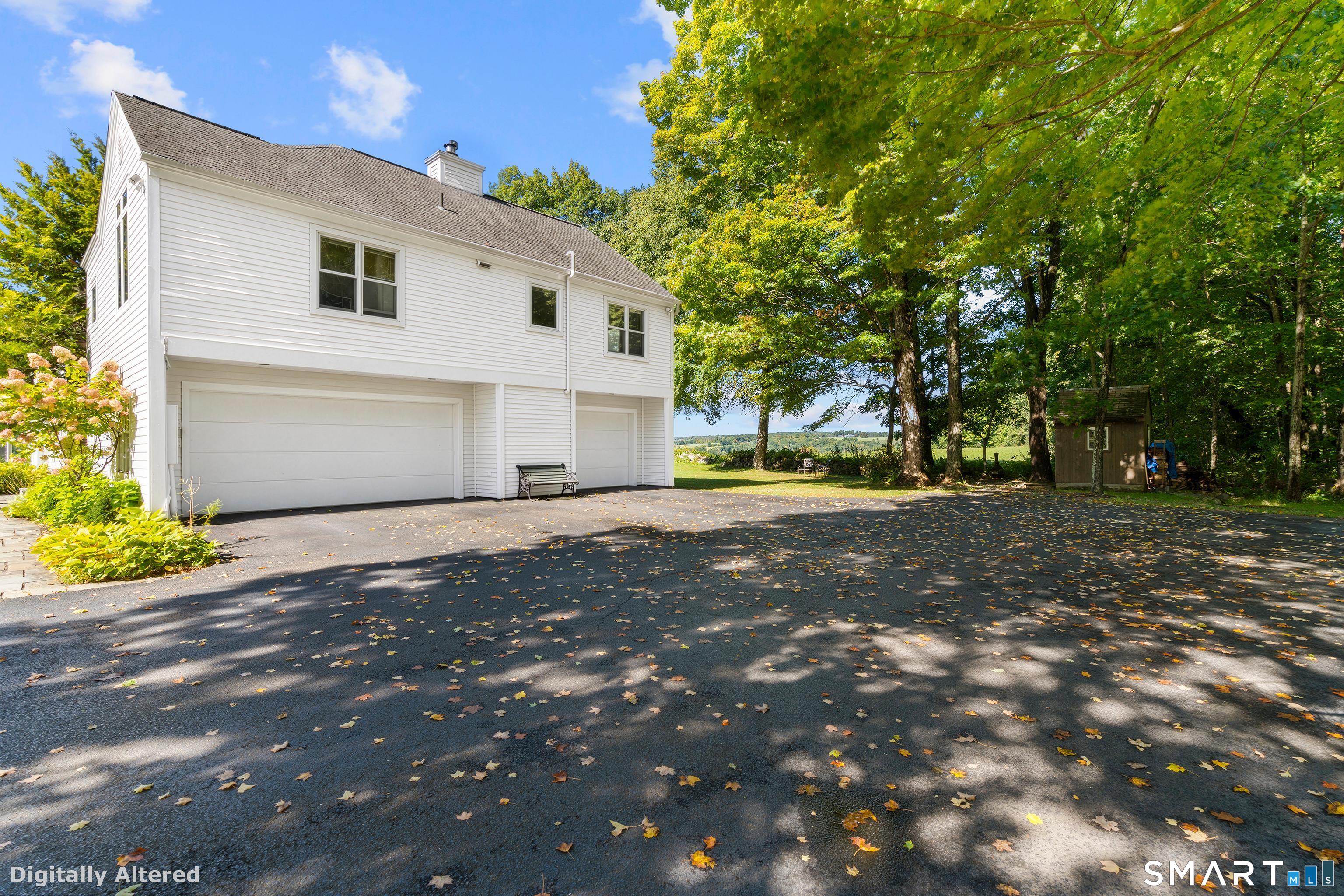 92 Quail Run Road Woodbury, CT 06798 - Photo 35 of 40 3Bay garages...imagine driving home and seeing this view from your garage. Altered to show siding completed.