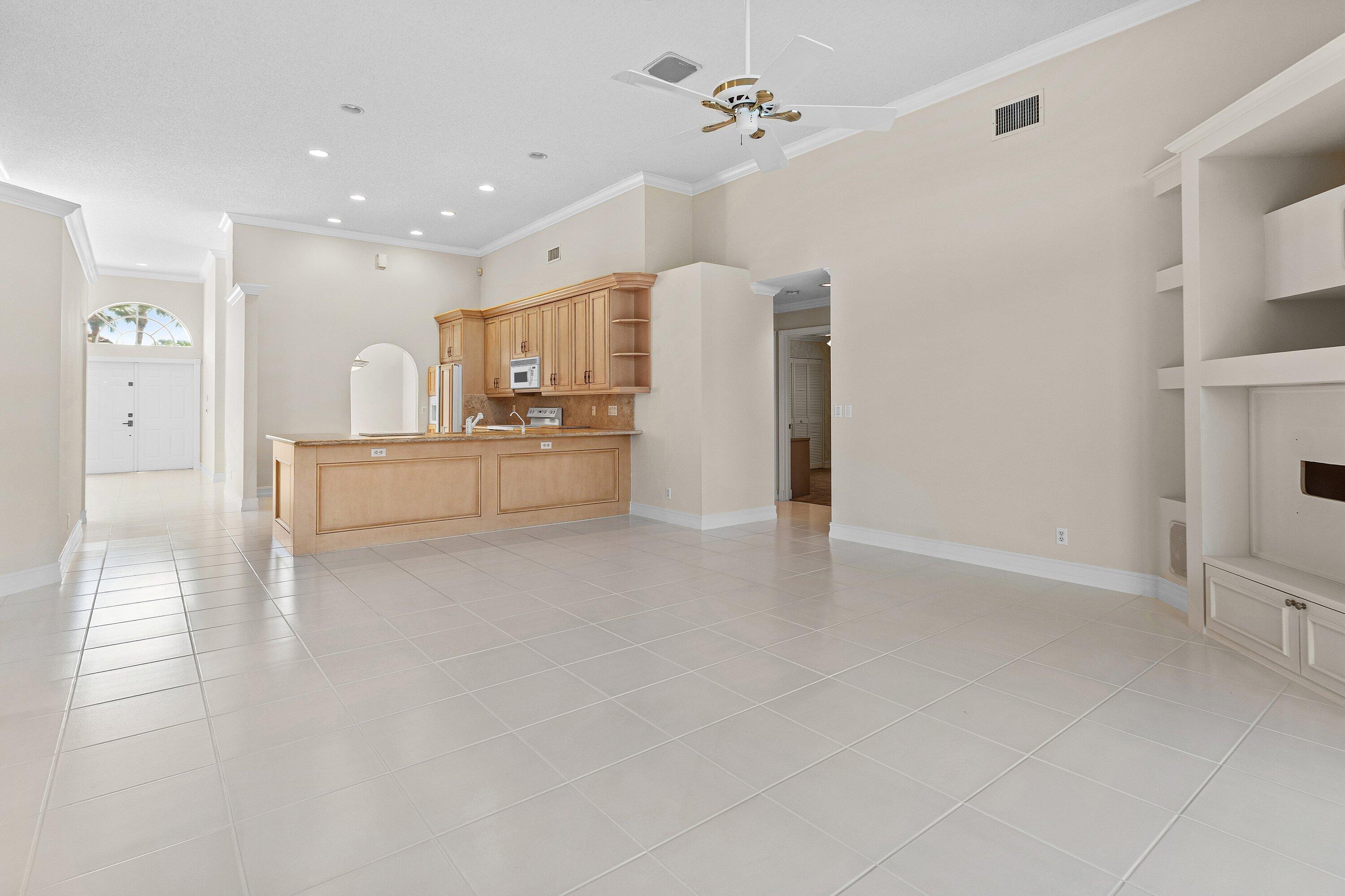 10653 St Thomas Drive Boca Raton, FL 33498 - Photo 17 of 62 Family Room and Kitchen
