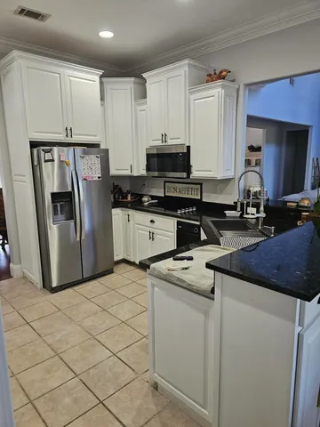 a bathroom with a sink a toilet a mirror and shower