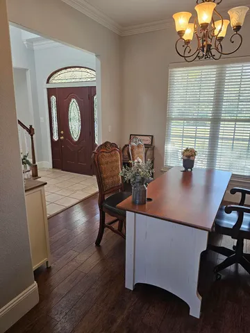 a view of entryway with a table and chair