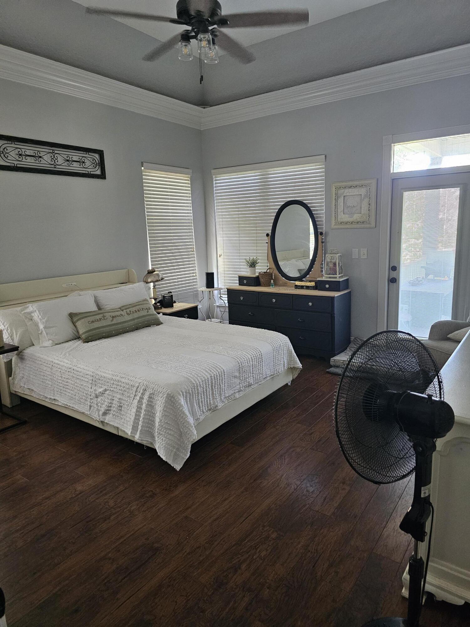 75 Evergreen Parkway DeFuniak Springs, FL 32435 - Photo 19 of 51 a bedroom with a bed window and a dresser