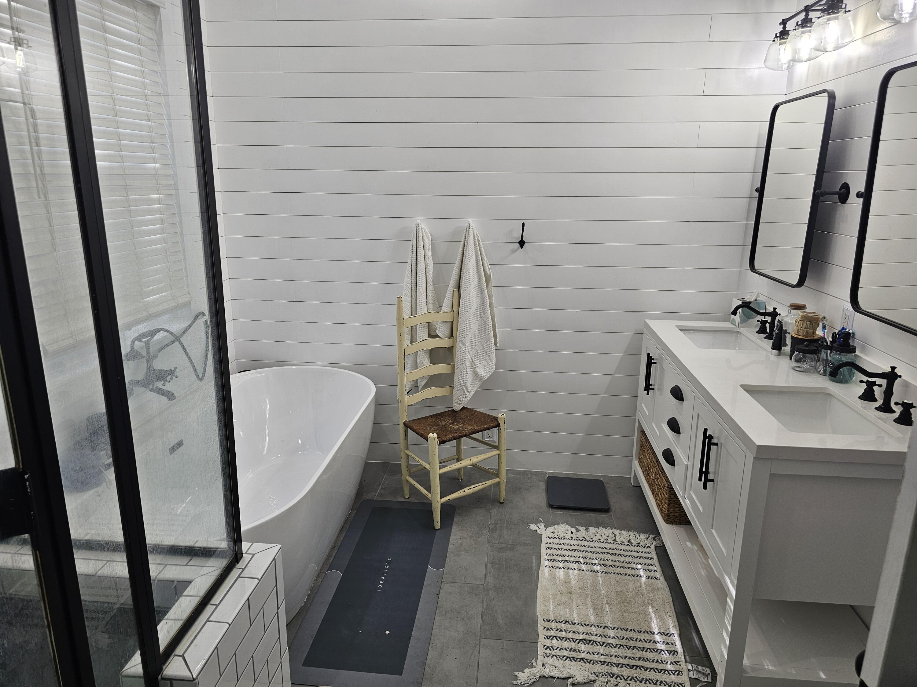 75 Evergreen Parkway DeFuniak Springs, FL 32435 - Photo 22 of 51 a bathroom with double vanity sink and mirror