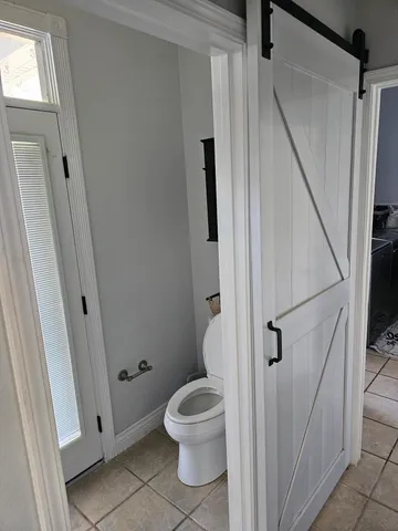 a view of a chairs and table on the deck
