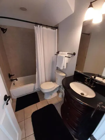 a view of a lake in between two of trees