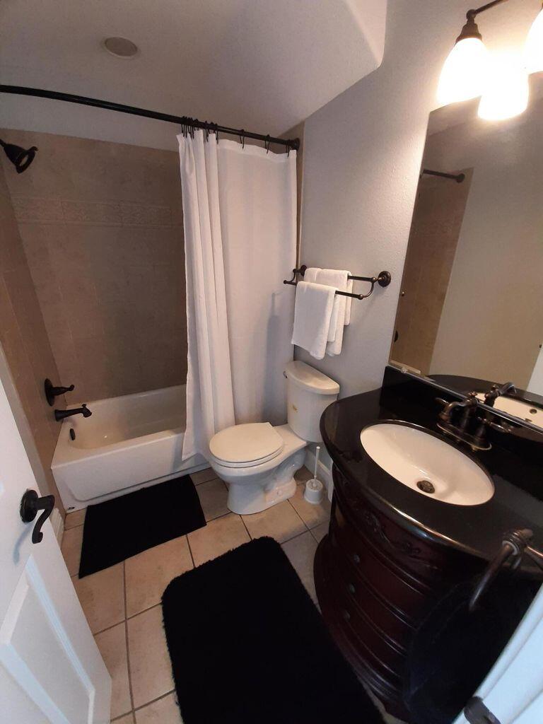 75 Evergreen Parkway DeFuniak Springs, FL 32435 - Photo 25 of 51 a bathroom with a sink a toilet a mirror and shower