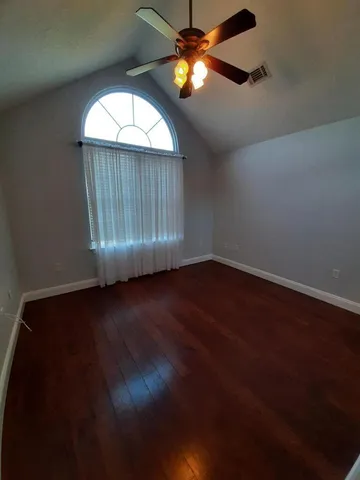 a view of dirt yard with a fountain