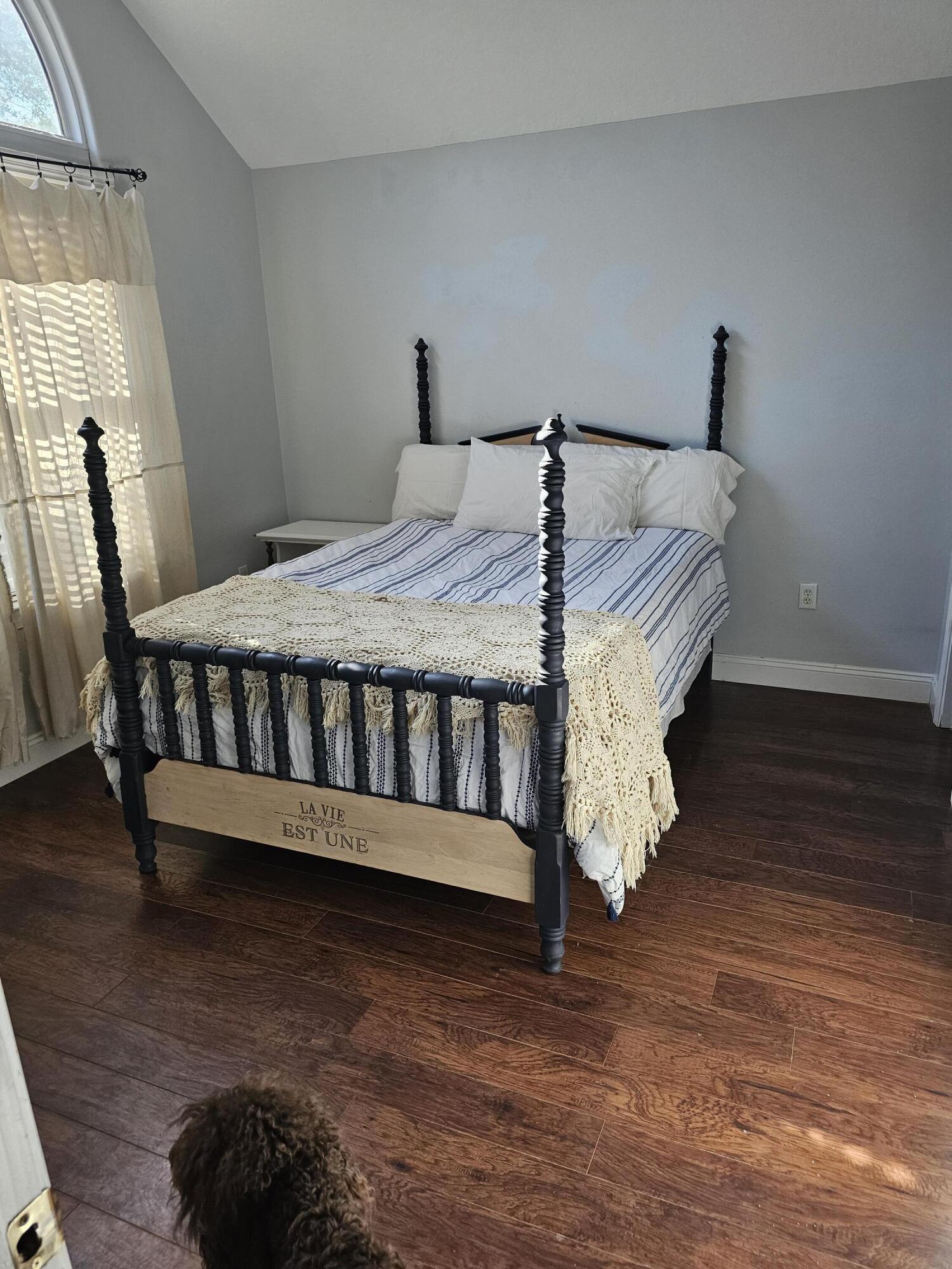 75 Evergreen Parkway DeFuniak Springs, FL 32435 - Photo 28 of 51 a bed sitting in a bedroom next to a window