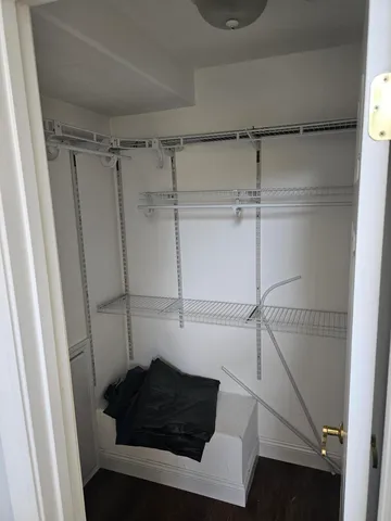 a view of an empty room with a fireplace