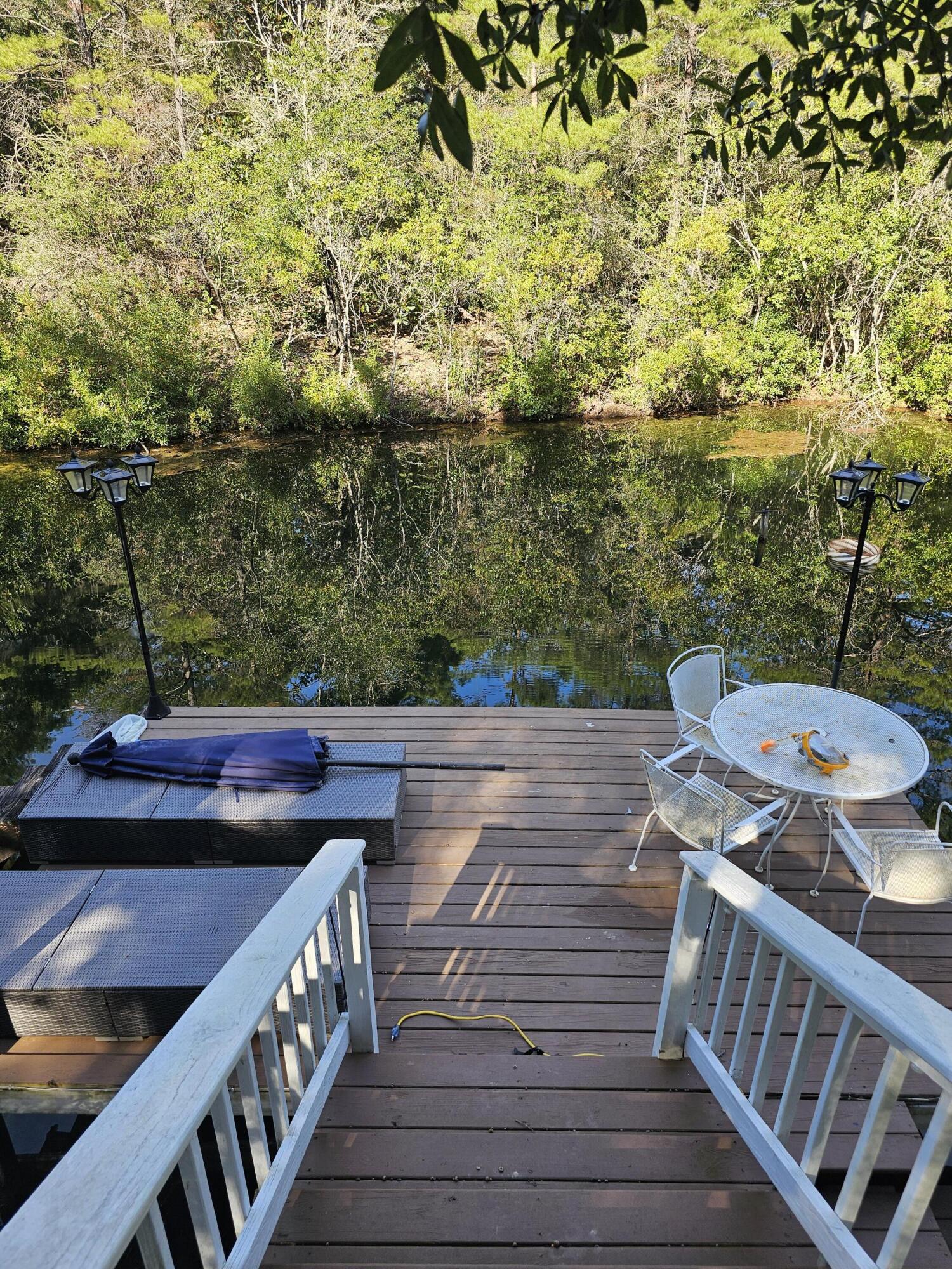 75 Evergreen Parkway DeFuniak Springs, FL 32435 - Photo 36 of 51 a view of deck and seating area