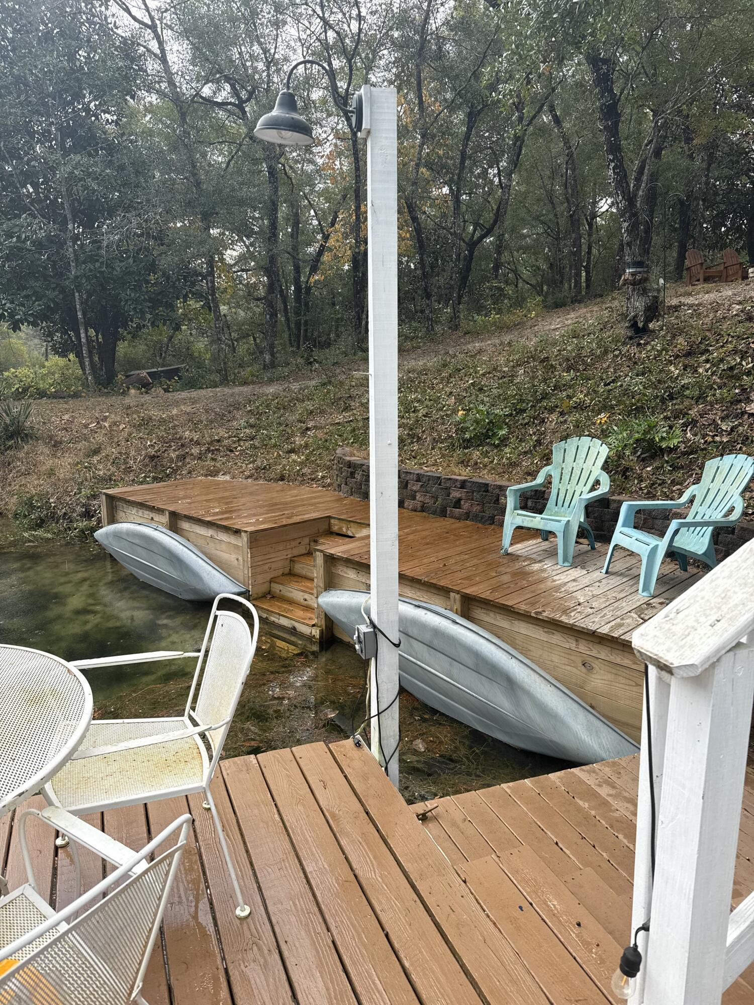 75 Evergreen Parkway DeFuniak Springs, FL 32435 - Photo 41 of 51 a view of a chairs and table on the deck
