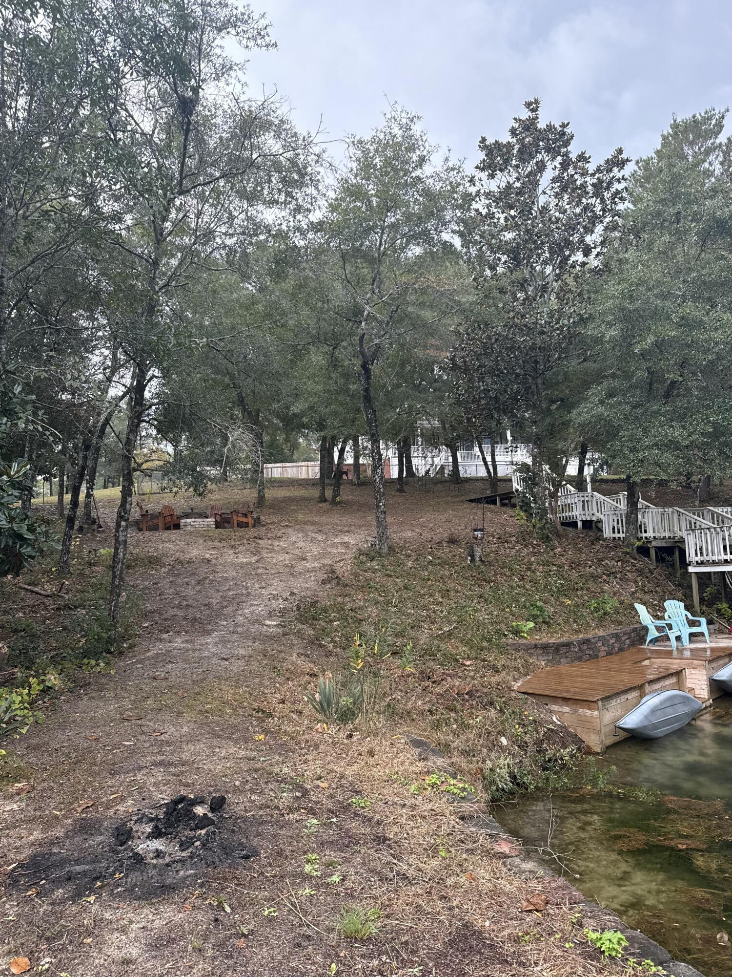75 Evergreen Parkway DeFuniak Springs, FL 32435 - Photo 43 of 51 a view of dirt yard with a fountain