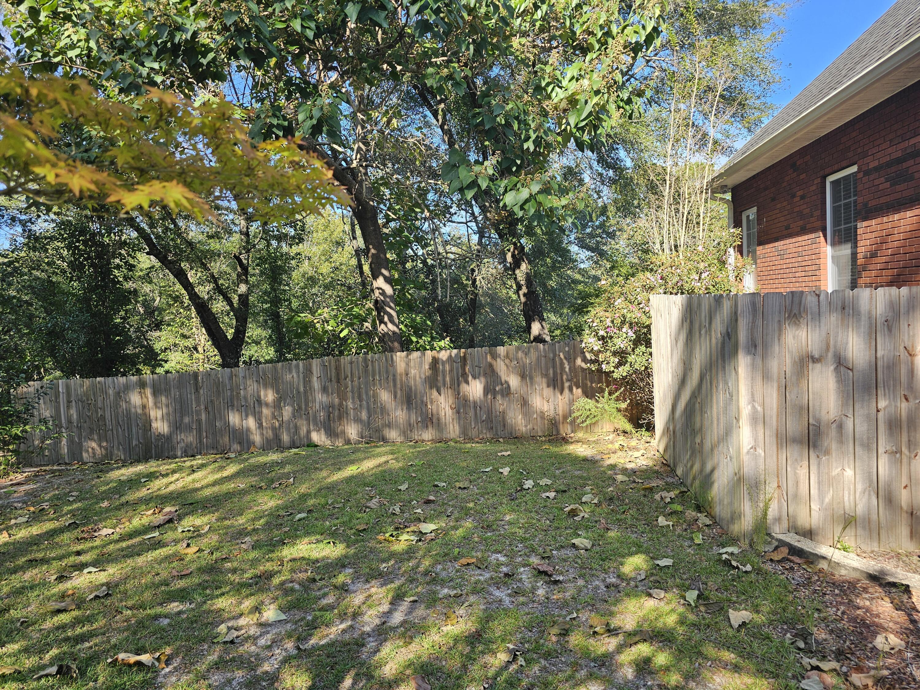 75 Evergreen Parkway DeFuniak Springs, FL 32435 - Photo 5 of 51 a view of backyard with tree