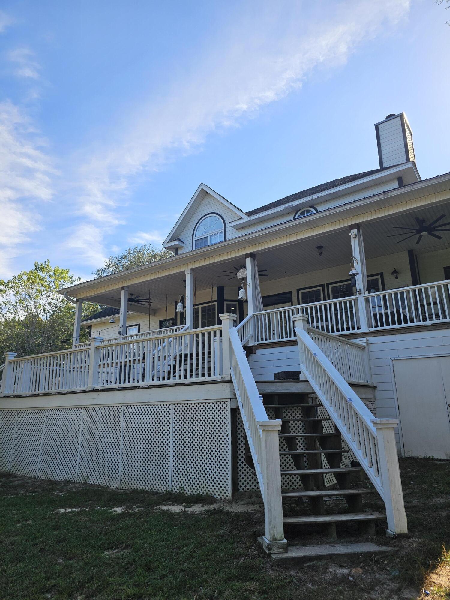 75 Evergreen Parkway DeFuniak Springs, FL 32435 - Photo 7 of 51 front view of a house with a yard