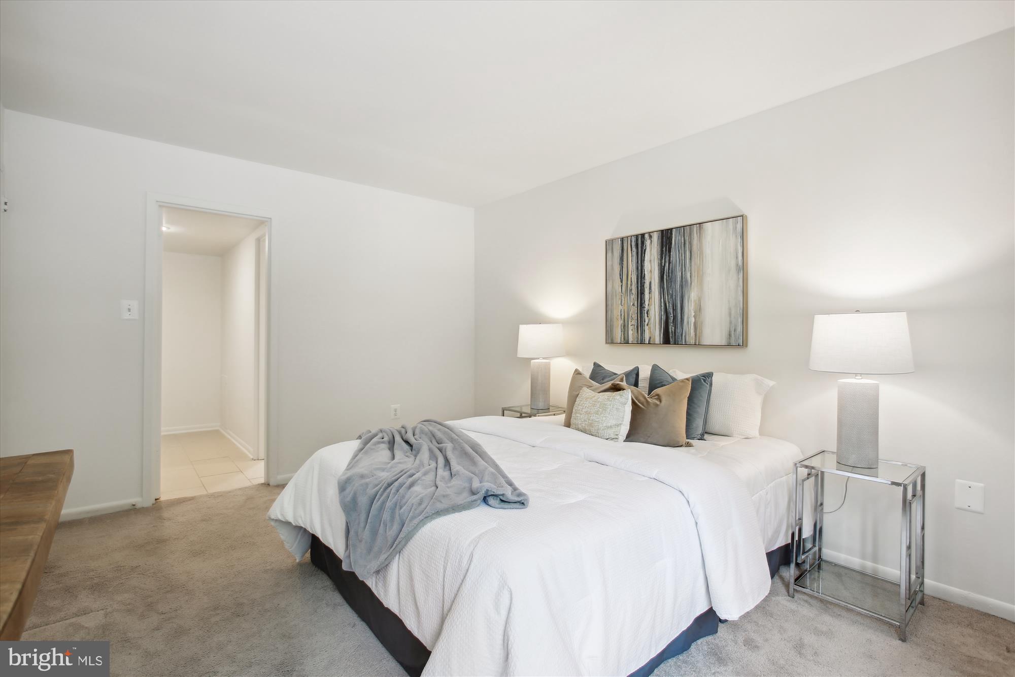 1408 Northgate Square, Unit 12B Reston, VA 20190 - Photo 17 of 31 View from Bedroom to Primary Closet and Bath.