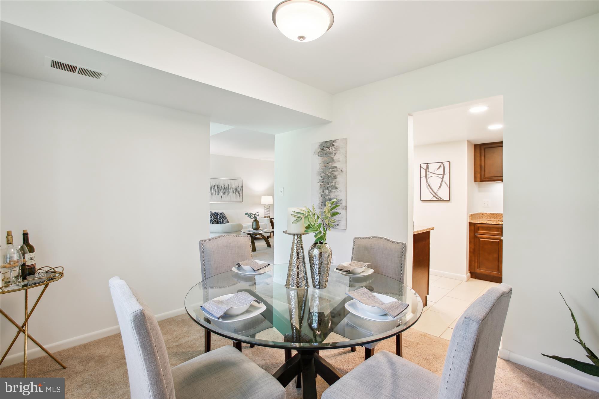 1408 Northgate Square, Unit 12B Reston, VA 20190 - Photo 9 of 31 View from Dining to Living Room and Kitchen