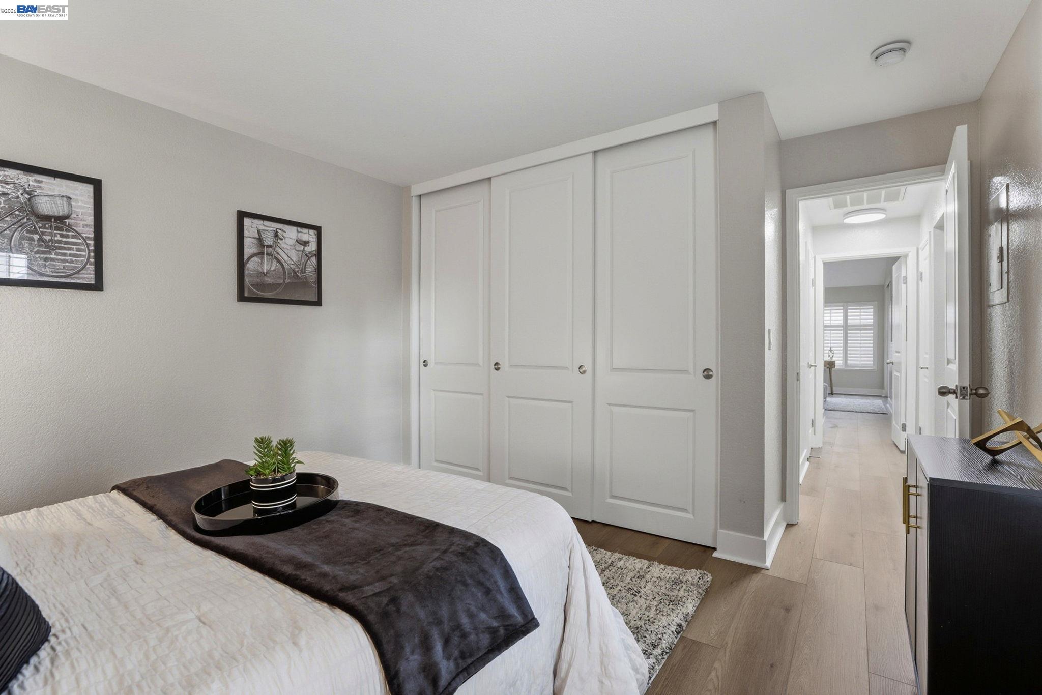 309 South Overlook Drive San Ramon, CA 94582 - Photo 14 of 29 a bedroom with a bed and wooden floor