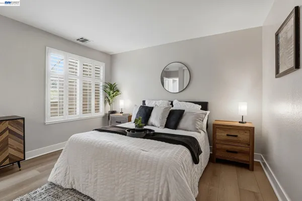 a bedroom with bed and a window