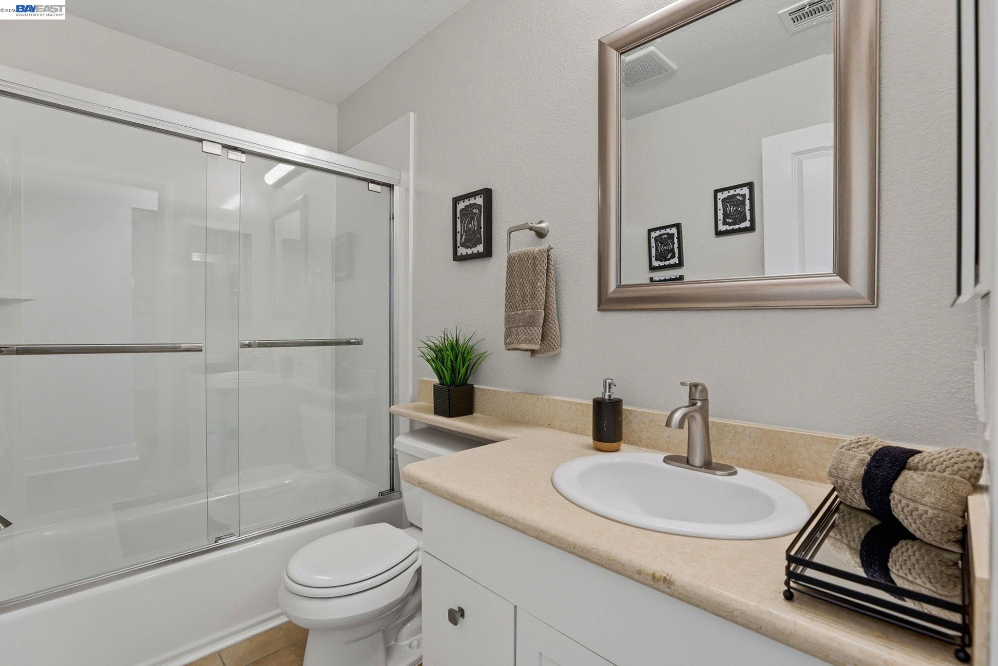 309 South Overlook Drive San Ramon, CA 94582 - Photo 18 of 29 a bathroom with a granite countertop sink mirror toilet and shower